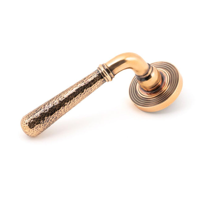 This is an image of From The Anvil - Polished Bronze Hammered Newbury Lever on Rose Set (Beehive) available to order from T.H Wiggans Architectural Ironmongery in Kendal, quick delivery and discounted prices.