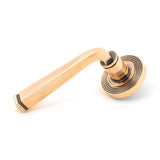 This is an image of From The Anvil - Polished Bronze Avon Round Lever on Rose Set (Beehive) available to order from T.H Wiggans Architectural Ironmongery in Kendal, quick delivery and discounted prices.