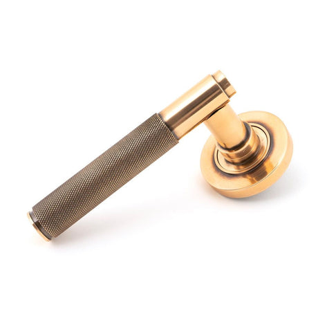 This is an image of From The Anvil - Polished Bronze Brompton Lever on Rose Set (Plain) available to order from T.H Wiggans Architectural Ironmongery in Kendal, quick delivery and discounted prices.