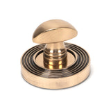 This is an image showing From The Anvil - Polished Bronze Round Thumbturn Set (Beehive) available from trade door handles, quick delivery and discounted prices