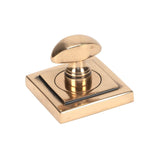 This is an image showing From The Anvil - Polished Bronze Round Thumbturn Set (Square) available from trade door handles, quick delivery and discounted prices