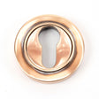 This is an image of From The Anvil - Polished Bronze Round Euro Escutcheon (Plain) available to order from T.H Wiggans Architectural Ironmongery in Kendal, quick delivery and discounted prices.