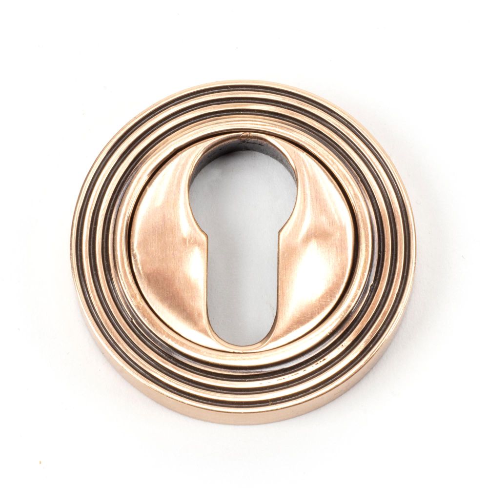 This is an image of From The Anvil - Polished Bronze Round Euro Escutcheon (Beehive) available to order from T.H Wiggans Architectural Ironmongery in Kendal, quick delivery and discounted prices.