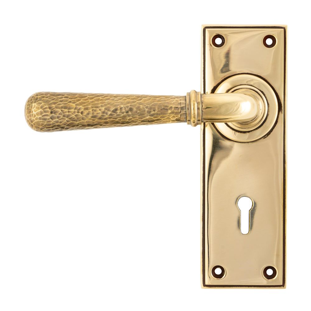 This is an image of From The Anvil - Aged Brass Hammered Newbury Lever Lock Set available to order from T.H Wiggans Architectural Ironmongery in Kendal, quick delivery and discounted prices.