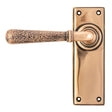 This is an image of From The Anvil - Polished Bronze Hammered Newbury Lever Latch Set available to order from T.H Wiggans Architectural Ironmongery in Kendal, quick delivery and discounted prices.