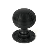 This is an image showing From The Anvil - Matt Black Heavy Beehive Mortice/Rim Knob Set available from trade door handles, quick delivery and discounted prices