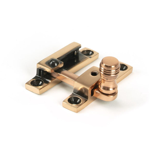 This is an image showing From The Anvil - Polished Bronze Prestbury Quadrant Fastener - Narrow available from T.H Wiggans Architectural Ironmongery in Kendal, quick delivery and discounted prices