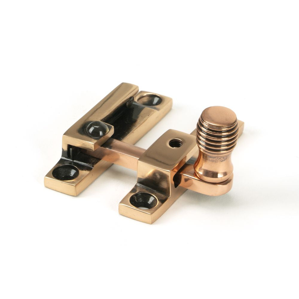 This is an image showing From The Anvil - Polished Bronze Beehive Quadrant Fastener - Narrow available from T.H Wiggans Architectural Ironmongery in Kendal, quick delivery and discounted prices