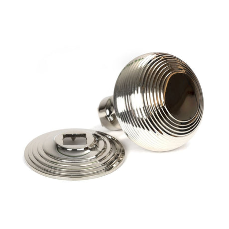 This is an image showing From The Anvil - Polished Nickel Beehive Centre Door Knob available from trade door handles, quick delivery and discounted prices