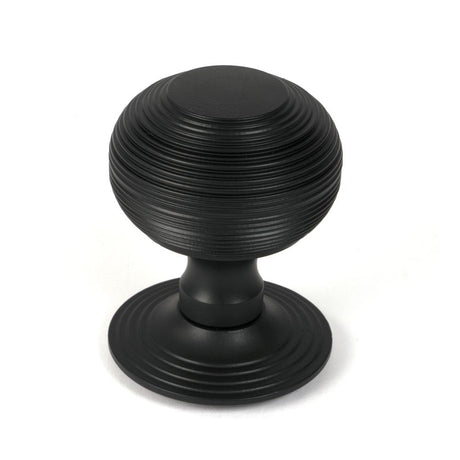 This is an image of From The Anvil - Matt Black Beehive Centre Door Knob available to order from T.H Wiggans Architectural Ironmongery in Kendal, quick delivery and discounted prices.