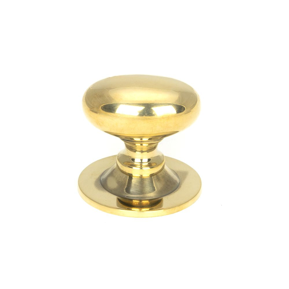 This is an image showing From The Anvil - Aged Brass Oval Cabinet Knob 33mm available from T.H Wiggans Architectural Ironmongery in Kendal, quick delivery and discounted prices