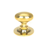 This is an image showing From The Anvil - Aged Brass Oval Cabinet Knob 40mm available from T.H Wiggans Architectural Ironmongery in Kendal, quick delivery and discounted prices