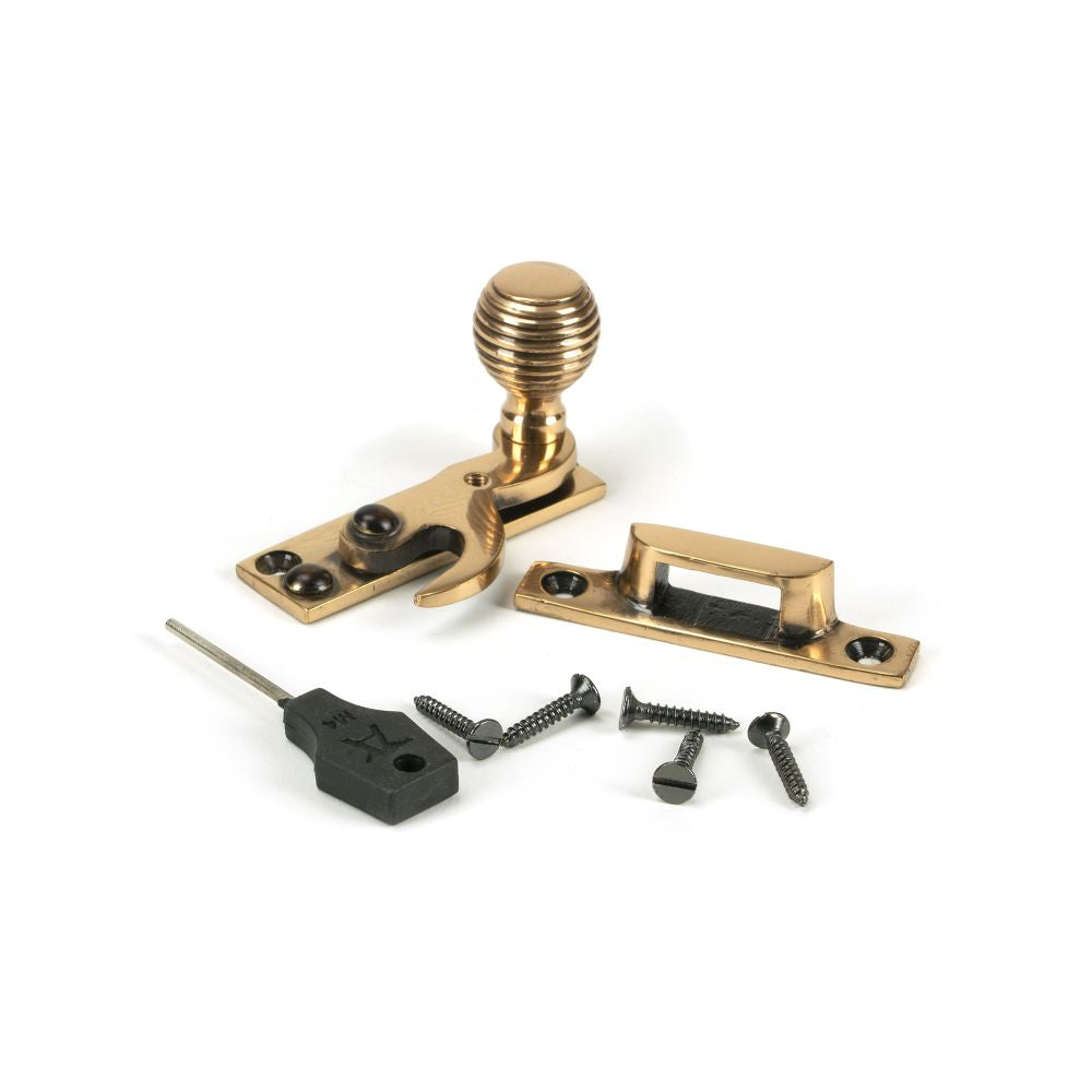 This is an image showing From The Anvil - Polished Bronze Beehive Sash Hook Fastener available from T.H Wiggans Architectural Ironmongery in Kendal, quick delivery and discounted prices