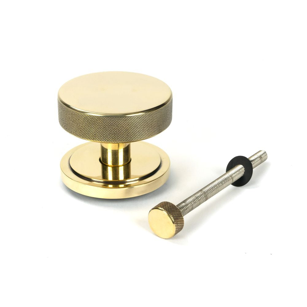 This is an image showing From The Anvil - Aged Brass Brompton Centre Door Knob (Art Deco) available from trade door handles, quick delivery and discounted prices