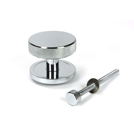 This is an image showing From The Anvil - Polished Chrome Brompton Centre Door Knob (Plain) available from trade door handles, quick delivery and discounted prices