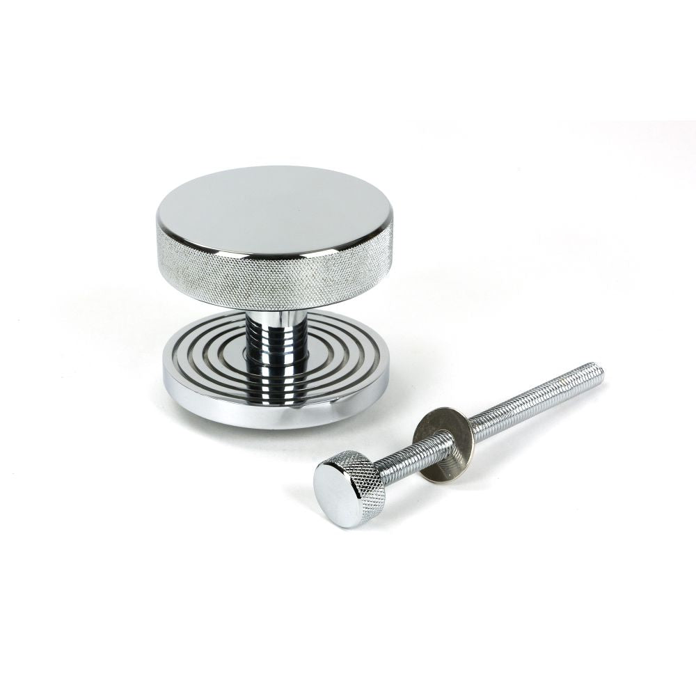 This is an image showing From The Anvil - Polished Chrome Brompton Centre Door Knob (Beehive) available from trade door handles, quick delivery and discounted prices