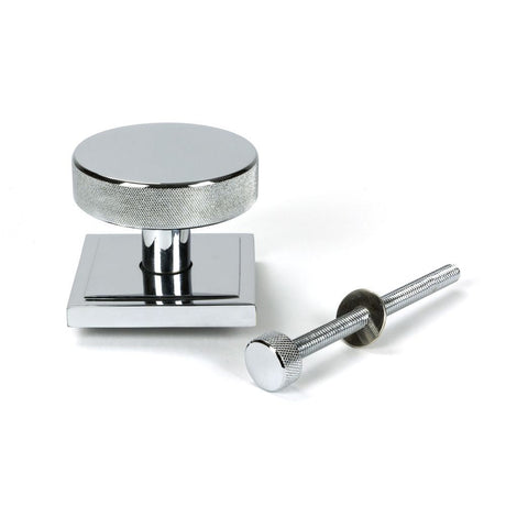 This is an image showing From The Anvil - Polished Chrome Brompton Centre Door Knob (Square) available from trade door handles, quick delivery and discounted prices