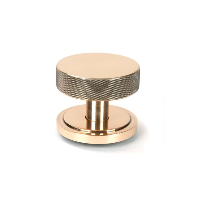 This is an image of From The Anvil - Polished Bronze Brompton Centre Door Knob (Art Deco) available to order from T.H Wiggans Architectural Ironmongery in Kendal, quick delivery and discounted prices.