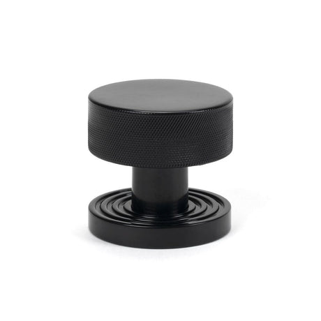 This is an image showing From The Anvil - Black Brompton Mortice/Rim Knob Set (Beehive) available from trade door handles, quick delivery and discounted prices