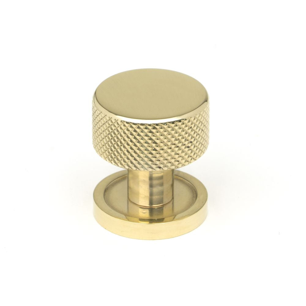 This is an image showing From The Anvil - Polished Brass Brompton Cabinet Knob - 25mm (Plain) available from T.H Wiggans Architectural Ironmongery in Kendal, quick delivery and discounted prices