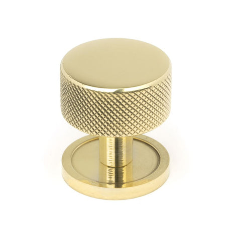 This is an image showing From The Anvil - Polished Brass Brompton Cabinet Knob - 32mm (Plain) available from T.H Wiggans Architectural Ironmongery in Kendal, quick delivery and discounted prices