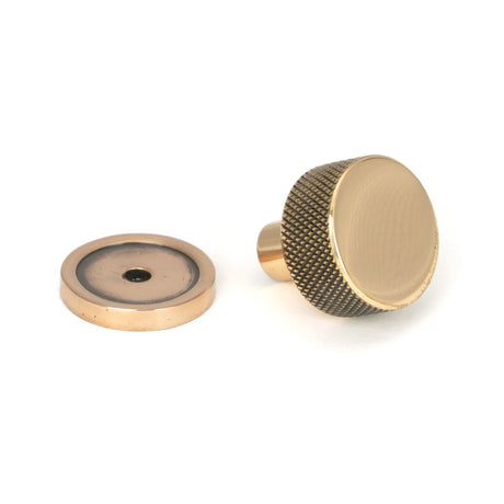 This is an image showing From The Anvil - Polished Bronze Brompton Cabinet Knob - 25mm (Plain) available from trade door handles, quick delivery and discounted prices
