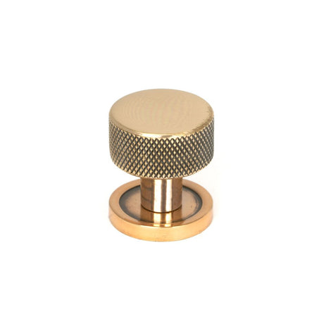 This is an image showing From The Anvil - Polished Bronze Brompton Cabinet Knob - 25mm (Plain) available from T.H Wiggans Architectural Ironmongery in Kendal, quick delivery and discounted prices