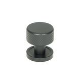 This is an image showing From The Anvil - Matt Black Brompton Cabinet Knob - 25mm (Plain) available from T.H Wiggans Architectural Ironmongery in Kendal, quick delivery and discounted prices