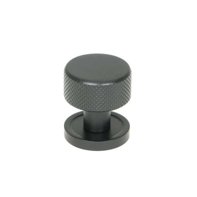This is an image showing From The Anvil - Matt Black Brompton Cabinet Knob - 25mm (Plain) available from T.H Wiggans Architectural Ironmongery in Kendal, quick delivery and discounted prices