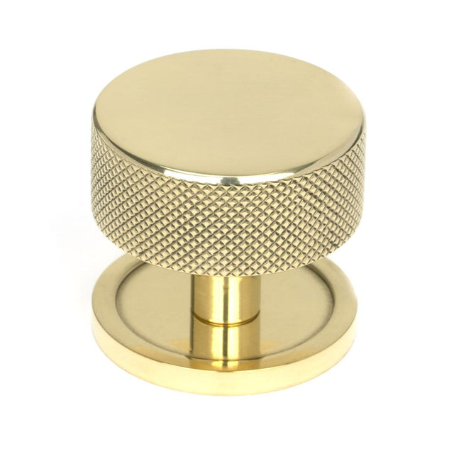 This is an image showing From The Anvil - Polished Brass Brompton Cabinet Knob - 38mm (Plain) available from T.H Wiggans Architectural Ironmongery in Kendal, quick delivery and discounted prices