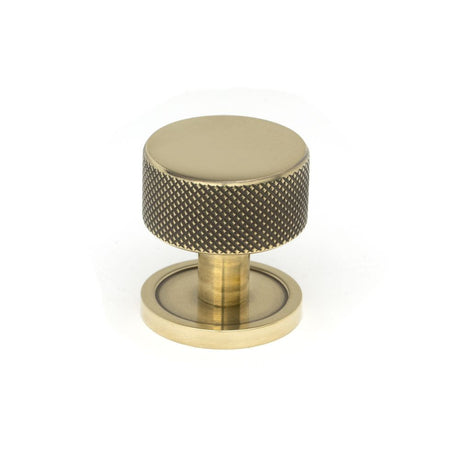 This is an image showing From The Anvil - Aged Brass Brompton Cabinet Knob - 32mm (Plain) available from T.H Wiggans Architectural Ironmongery in Kendal, quick delivery and discounted prices