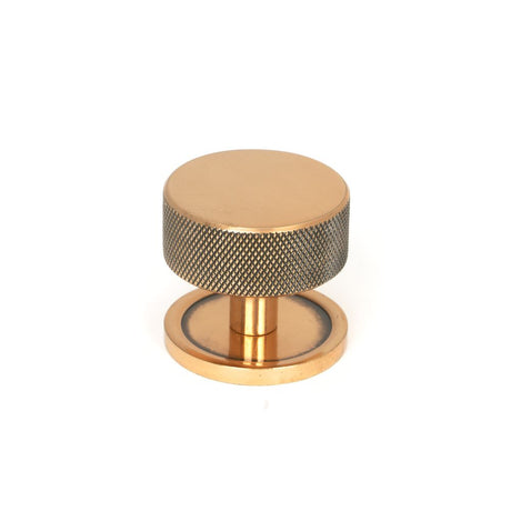 This is an image showing From The Anvil - Polished Bronze Brompton Cabinet Knob - 38mm (Plain) available from T.H Wiggans Architectural Ironmongery in Kendal, quick delivery and discounted prices