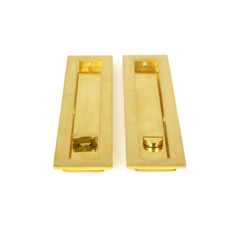 This is an image showing From The Anvil - Polished Brass 250mm Plain Rectangular Pull - Privacy Set available from trade door handles, quick delivery and discounted prices