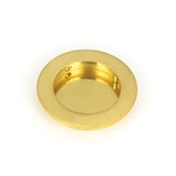 This is an image of From The Anvil - Polished Brass 75mm Plain Round Pull available to order from T.H Wiggans Architectural Ironmongery in Kendal, quick delivery and discounted prices.