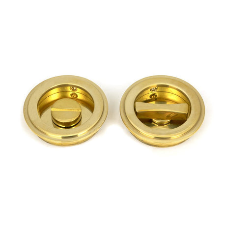 This is an image of From The Anvil - Polished Brass 60mm Art Deco Round Pull - Privacy Set available to order from T.H Wiggans Architectural Ironmongery in Kendal, quick delivery and discounted prices.