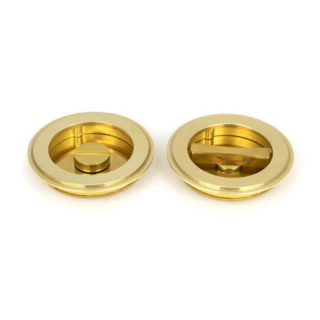 This is an image of From The Anvil - Polished Brass 75mm Art Deco Round Pull - Privacy Set available to order from T.H Wiggans Architectural Ironmongery in Kendal, quick delivery and discounted prices.