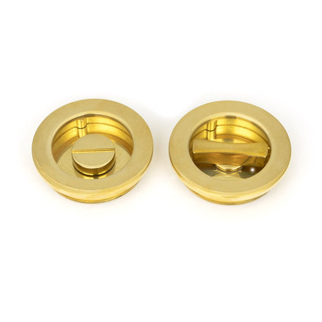 This is an image of From The Anvil - Polished Brass 60mm Plain Round Pull - Privacy Set available to order from T.H Wiggans Architectural Ironmongery in Kendal, quick delivery and discounted prices.