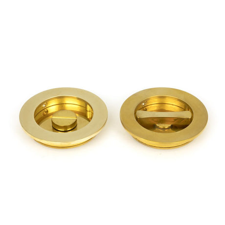 This is an image of From The Anvil - Polished Brass 75mm Plain Round Pull - Privacy Set available to order from T.H Wiggans Architectural Ironmongery in Kendal, quick delivery and discounted prices.