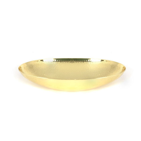 This is an image showing From The Anvil - Hammered Brass Oval Sink available from T.H Wiggans Architectural Ironmongery in Kendal, quick delivery and discounted prices
