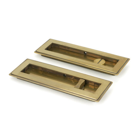 This is an image of From The Anvil - Aged Brass 175mm Art Deco Rectangular Pull - Privacy Set available to order from T.H Wiggans Architectural Ironmongery in Kendal, quick delivery and discounted prices.