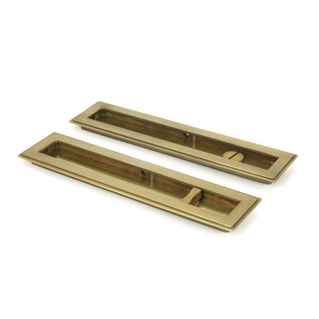 This is an image of From The Anvil - Aged Brass 250mm Art Deco Rectangular Pull - Privacy Set available to order from T.H Wiggans Architectural Ironmongery in Kendal, quick delivery and discounted prices.