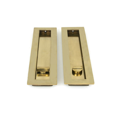 This is an image showing From The Anvil - Aged Brass 250mm Plain Rectangular Pull - Privacy Set available from trade door handles, quick delivery and discounted prices