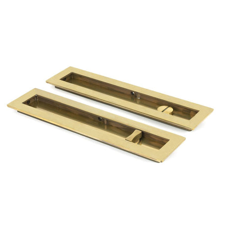 This is an image of From The Anvil - Aged Brass 250mm Plain Rectangular Pull - Privacy Set available to order from T.H Wiggans Architectural Ironmongery in Kendal, quick delivery and discounted prices.