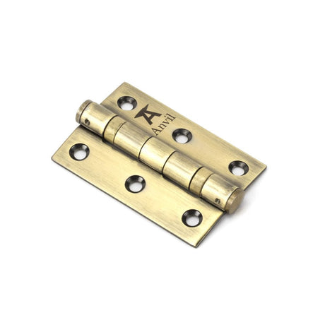 This is an image showing From The Anvil - Aged Brass 3" Ball Bearing Butt Hinge (pair) ss available from T.H Wiggans Architectural Ironmongery in Kendal, quick delivery and discounted prices