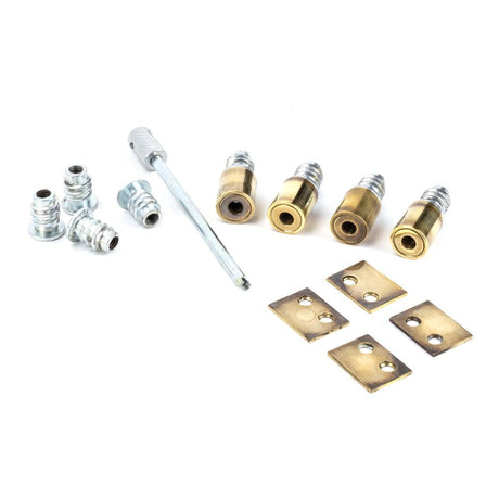 This is an image showing From The Anvil - Aged Brass Secure Stops (Pack of 4) available from T.H Wiggans Architectural Ironmongery in Kendal, quick delivery and discounted prices