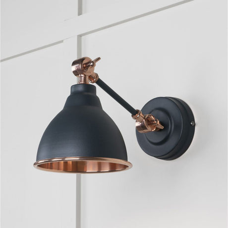 This is an image showing From The Anvil - Smooth Copper Brindley Wall Light in Soot available from T.H Wiggans Architectural Ironmongery in Kendal, quick delivery and discounted prices