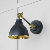 This is an image showing From The Anvil - Smooth Brass Brindley Wall Light in Soot available from T.H Wiggans Architectural Ironmongery in Kendal, quick delivery and discounted prices