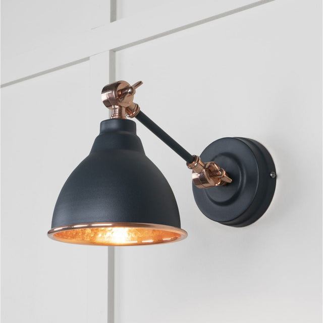 This is an image showing From The Anvil - Hammered Copper Brindley Wall Light in Soot available from T.H Wiggans Architectural Ironmongery in Kendal, quick delivery and discounted prices