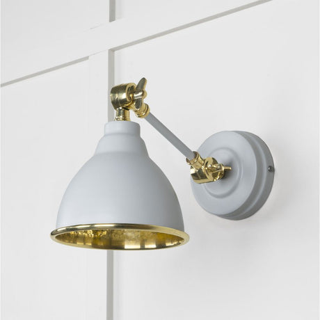 This is an image showing From The Anvil - Hammered Brass Brindley Wall Light in Birch available from T.H Wiggans Architectural Ironmongery in Kendal, quick delivery and discounted prices