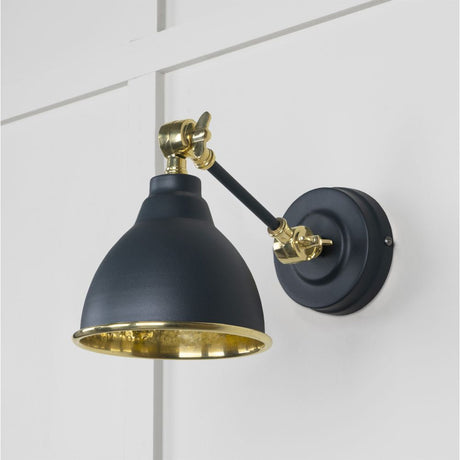 This is an image showing From The Anvil - Hammered Brass Brindley Wall Light in Soot available from T.H Wiggans Architectural Ironmongery in Kendal, quick delivery and discounted prices